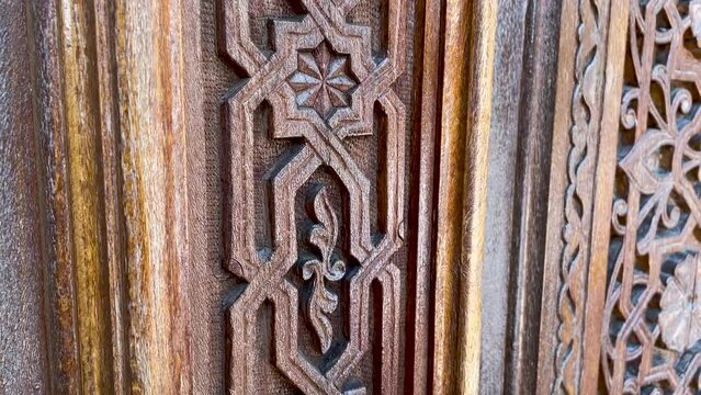 Wooden carving patterns on the doors of a Muslim mosque