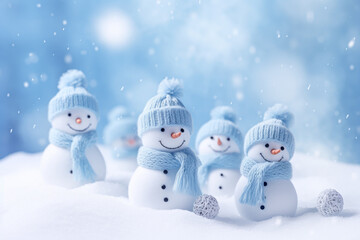 Snowman family in knitted hat and scarf on snow background.