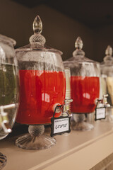 Red drinks in plastic dispensers