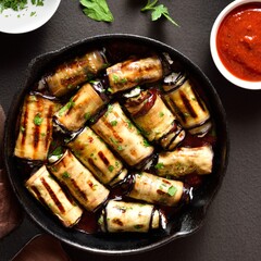 Eggplant (aubergine) rolls with cheese and greens