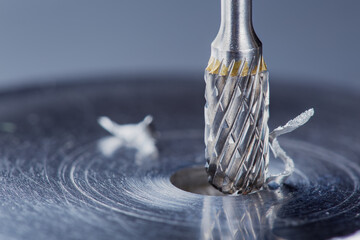 Milling cutter make sink in hole in steel billet. Locksmith work.