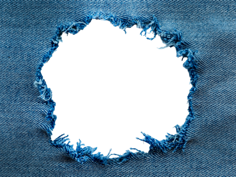 Hole in denim on a white background. Ripped jeans
