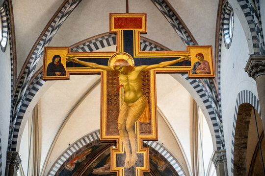 Florence, Italy- January 14, 2023: Golden cross of Jesus in Santa Maria la Novella, Florence, Italy
