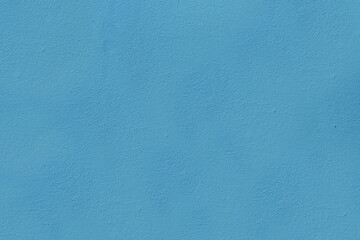 The surface of the old blue wall damaged by time.