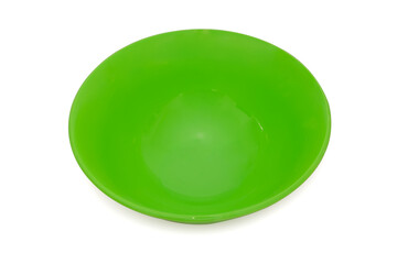 Green plastic round plate on a white background.