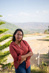 female smile and sitting on chair mountain