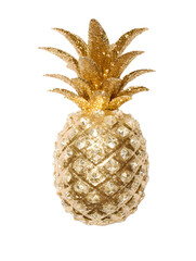 Pineapple covered with shimmering golden glitter, white background