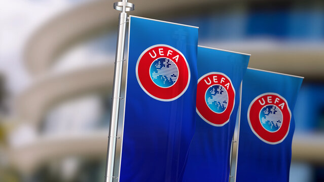 Three vertical banners with UEFA logo waving in the wind.