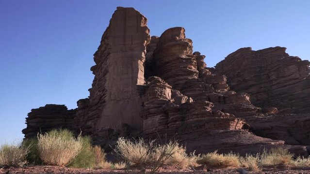 Cinematic View of Massive Red Sandstone Rock Monolith and Formations in Hisma Desert NEOM Saudi Arabia
