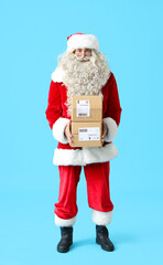 Santa Claus with parcels on blue background