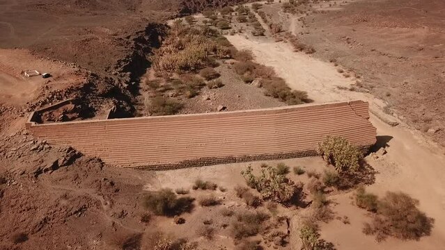 Cinematic Aerial Drone View of Ancient Archaeological Stone Dam Sadd Al Bint in Khaybar Saudi Arabia