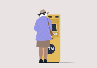 A rear view of a senior lady withdrawing money from an outdoor ATM machine