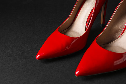 Stylish Red High Heels On Black Background