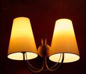 Interior chandelier in orange, yellow and golden colors.