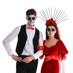 Young couple dressed for Mexico's Day of the Dead (El Dia de Muertos) on white background