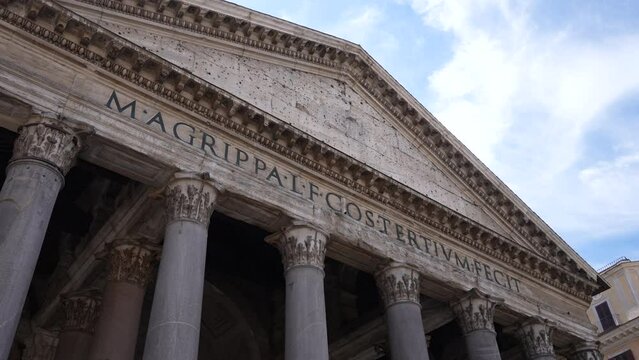 Closeup view of pantheon roman temple facade, Piazza della Rotonda, Rome, Italy on sunny day. Latin inscription reads: M. Agrippa, son of Lucius, built this when he was consul for the third time