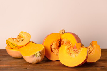 Cut fresh pumpkins on wooden table