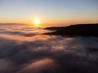 Drone view of Umbria valley Italy above a sea of fog at sunset - 667875731
