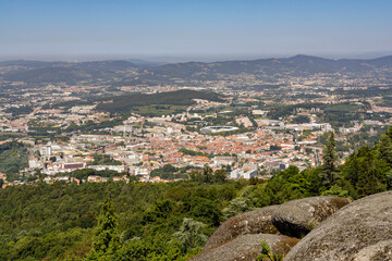 Fototapeta na wymiar Panoramic view of Guimaraes from Santa Catarina hill. Guimaraes is one of the finest cities in northern Portugal, and is fondly regarded by the portuguese as the birthplace their country. 