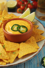 Corn tortilla chips with cheese sauce