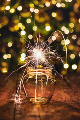 Christmas background with sparkler in a jar - 667896906