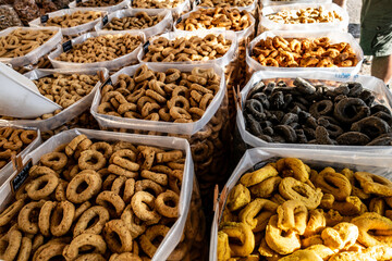 Containers of Tarallini, traditional bread bites on sale at a market stall in Polignamo, Italy..