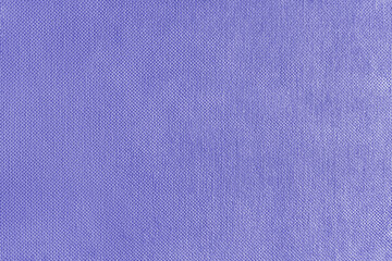 Texture background of purple velours fabric. Textile structure, cloth surface, weaving of jacquard material closeup. Upholstery, curtains, backdrop, wallpaper.