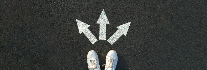 Woman standing near arrows