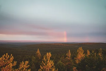 Fototapeten Sunrise and rainbow © Melanie