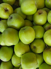 Close-up of fresh green apples on the farmers market