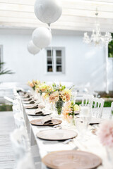 Beautiful table set for an event party or wedding reception . restaurant interior	