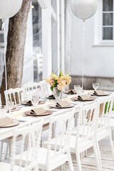 Beautiful table set for an event party or wedding reception . restaurant interior	
