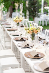 Beautiful table set for an event party or wedding reception . restaurant interior	