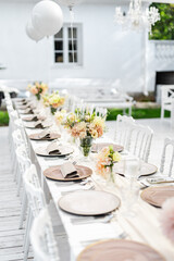 Beautiful table set for an event party or wedding reception . restaurant interior	