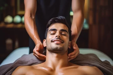 Keuken foto achterwand Massagesalon Young Asian massage therapist doing his job, handsome male getting relaxed in a massaging spa salon, relaxed male