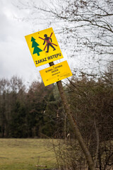 Yellow information board in the forest 
