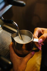 pouring coffee into a cup