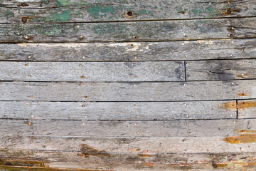 Background texture of weathered wooden boards of a shipwreck