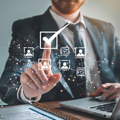 Human resources management, HR, Recruitment, Employment, Teamwork, Leadership and teambuilding. Businessman select of checkbox and Fill out an online employee assessment form on network