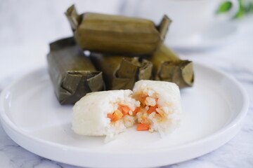 Arem-arem, a traditional food made from rice filled with vegetables, chicken, meat or tempeh wrapped in banana leaves. Arem-arem is popular as a breakfast substitute