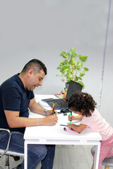 3-year-old brunette curly-haired Latin girl draws as therapy for her autism and ADHD with...