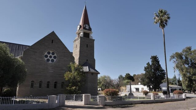 Stone architecture of Dutch Reformed Church, Loxton RSA, palm tree