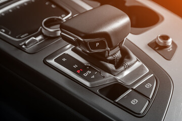 Close up of the manual gearbox transmission handle. Accelerator handle and buttons in a new car. .