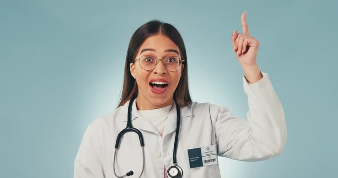 Studio woman face, idea and doctor thinking, excited or remember healthcare, cardiology and planning eureka solution. Clinic inspiration, aha facial expression and nurse innovation on blue background