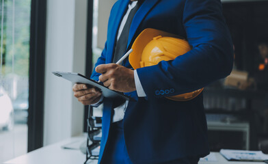 Civil Engineer Hispanic smiling with Constuction backgrounds, use for banner cover. Success in target of project goal Handsome Middle Eastern worker.