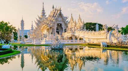 White temple Chiang Rai during sunset, view of Wat Rong Khun or White Temple Chiang Rai, Thailand