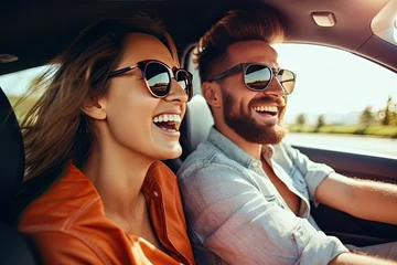 Fotobehang transport, road trip, technology and people concept - smiling couple driving in car, travel concept © ttonaorh