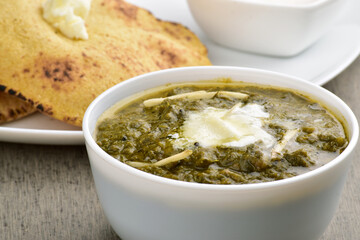 Healthy saag bowl at dining table