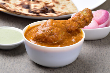 Bowl of butter chicken at dinner table