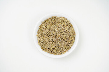Cumin seeds on white background top view